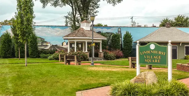 Lindenhurst Village Square on a summer day, with the gazebo and the Village Square sign
